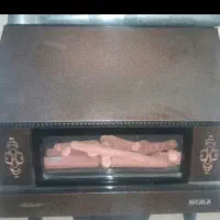 بخاری شومینه دار در حد نو و بسیار تمیز