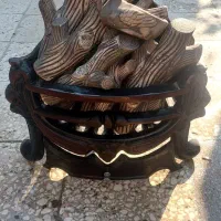 منقل شومینه چدنی به همراه چوب ش‌مینه