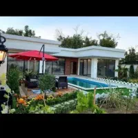 ویلا با نمای شیک /حیاط با گل کاری زیبا /درشمال