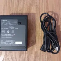 شارژر باتری اصلی دوربین کانن LC E10C|دوربین عکاسی و فیلم‌برداری|پردیس, فاز ۲|دیوار