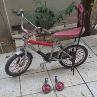 دوچرخه ۱۶ بادوعددکمک اصلی