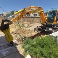 اجاره مینی بیل لاستیکی چکش وپاکت تخریب وخاکبرداری