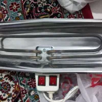 بخاری برقی  و چمدان مسافرتی چرم