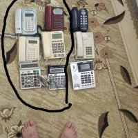 تعدادی گوشی تلفن خانگی وماشین حساب