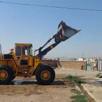 لودر و کامیون تسطیح زمین و خاکبرداری