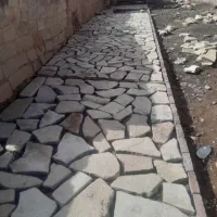 اجرا ی سنگ فرش وجدول محوطه سازی