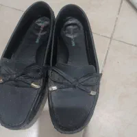 چند جفت کفش|کیف، کفش، کمربند|گلبهار, شهر جدید گلبهار|دیوار