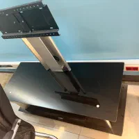 میز تلویزیون شیشه ای پایه دار متحرک