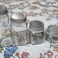 بانکه شیشه ای درب فلز جاحبوبات یا ادویه