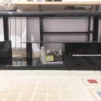 میز تلویزیون شیشه خم خارجی همراه با کشو