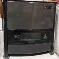 بخاری جهان افروز۱۲۵۰۰درحدنوهمراه لوله بخاری+شیلنگ