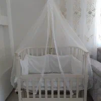 گهواره کنار مادر