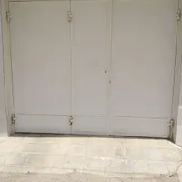 درب پارکینگ تمیز بدون زنگ خوردگی|مصالح و تجهیزات ساختمان|بندر دیر, |دیوار
