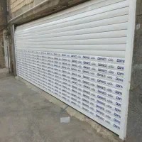 سکوریت.درب کرکره برقی شیشه ساختمانی و توری پلیسه