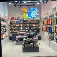 فروشنده لباس کودک و نوزاد پاساژ شاپرک دردشت