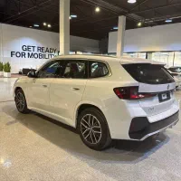 بی‌ام‌و iX1 eDrive 25L، مدل ۲۰۲۵ سفید تو قرمز|خودرو سواری و وانت|تهران, نیاوران|دیوار