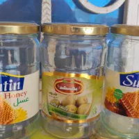 شیشه خالی ترشی و خیار شور و زیتون