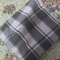 تعدادی پارچه و مانتو و کت و....