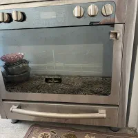 اجاق گاز فر دار بسیار تمیز کم کارکرده و نو
