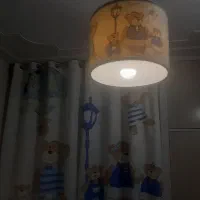 ست پرده چراغ خواب ساعت و لوستر اتاق کودک