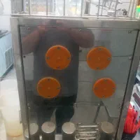 دستگاه  صنعتی آب پرتقال و آب انار گیری اتوماتیک