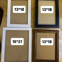 تعدادی قاب عکس در رنگ های مشکی و سفید و قهوه