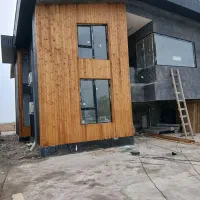 نصب چوب ترمو نما ساختمان سازنده پله گرد با پلی وود|خدمات پیشه و مهارت|رشت, منظریه|دیوار