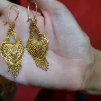 طلای نو گوشواره همرا با پاکتور 400 بالای تابلو