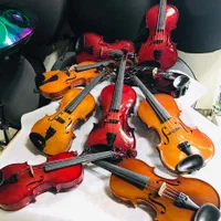 فروش انواع ویولن و گیتار و هنگ درام دف تنبک