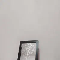 آینه با طرح گُلِ حک شده