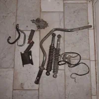کمک عقب وکاربرات دسته موتور و چند قطعه دیگر