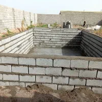 اجرای دیوار بلوکی وآجری وشیب بندی