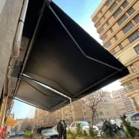سایبان مغازه بازویی فنری برقی نیم کره دستی ثابت