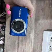 دوربین عکاسی کنون و پروژکتور جیبی