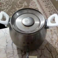 یک کتری رو گازی شیردار