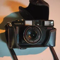 دوربین یاشیکا و کیف چرم