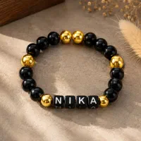 دستبند دست‌ساز NIKA  مشکی و طلایی  خاص و شیک