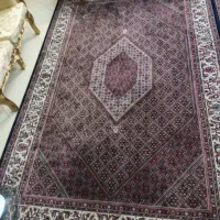 دو جفت فرش و مبل و میز نهار خوری و چکمه بلند