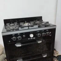 اجاق گاز طرح فر صفحه شیشه‌ای در حد نو