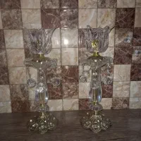 یک جفت شمعدان به همراه ساعت برنجی رومیزی