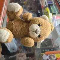 یک عدد خرس عروسک و شارژر تاپسی خوب کنفی