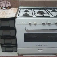 اجاق گاز فردار پنج شعله با در پوش شیشه ای شعله ها
