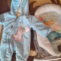 آغوش بچه با یه لباس گرم زوستانی نو
