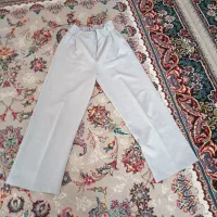 یه شلوار زنانه بلند رنگ طوسی و یک عدد شلوار گرم