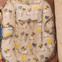 تشک غلت گیر و ساک حمل نوزاد