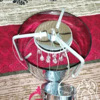 لوستر گرد آینه ای و مجسمه دکوری