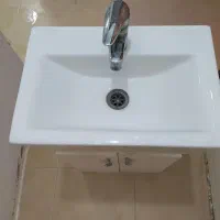 روشویی و‌کمد و شیرآب