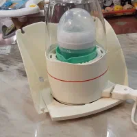 دستگاه استریلیزه وگرم کننده شیر وشیشه شیر کودک