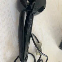 یک دستگاه مو فر کن