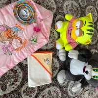 سیسمونی نوزاد،کیسه خواب، عروسک گربه، بطری شیر، ظرف